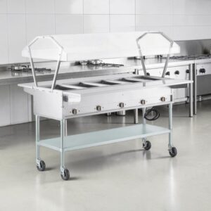 MESA CALIENTE ELECTRICA BANO MARIA CON ENTREPANO Y REPISA ALTA ANTIESTORNUDOS DE DOS LADOS Y DOS REPISAS DESLIZADORAS EN ACERO INOXIDABLE PARA 5 INSERTOS 208/240V, 3750W MEDIDAS: 71 X 47 3/16 X 57 1/2 PG CON RUEDAS SERVIT